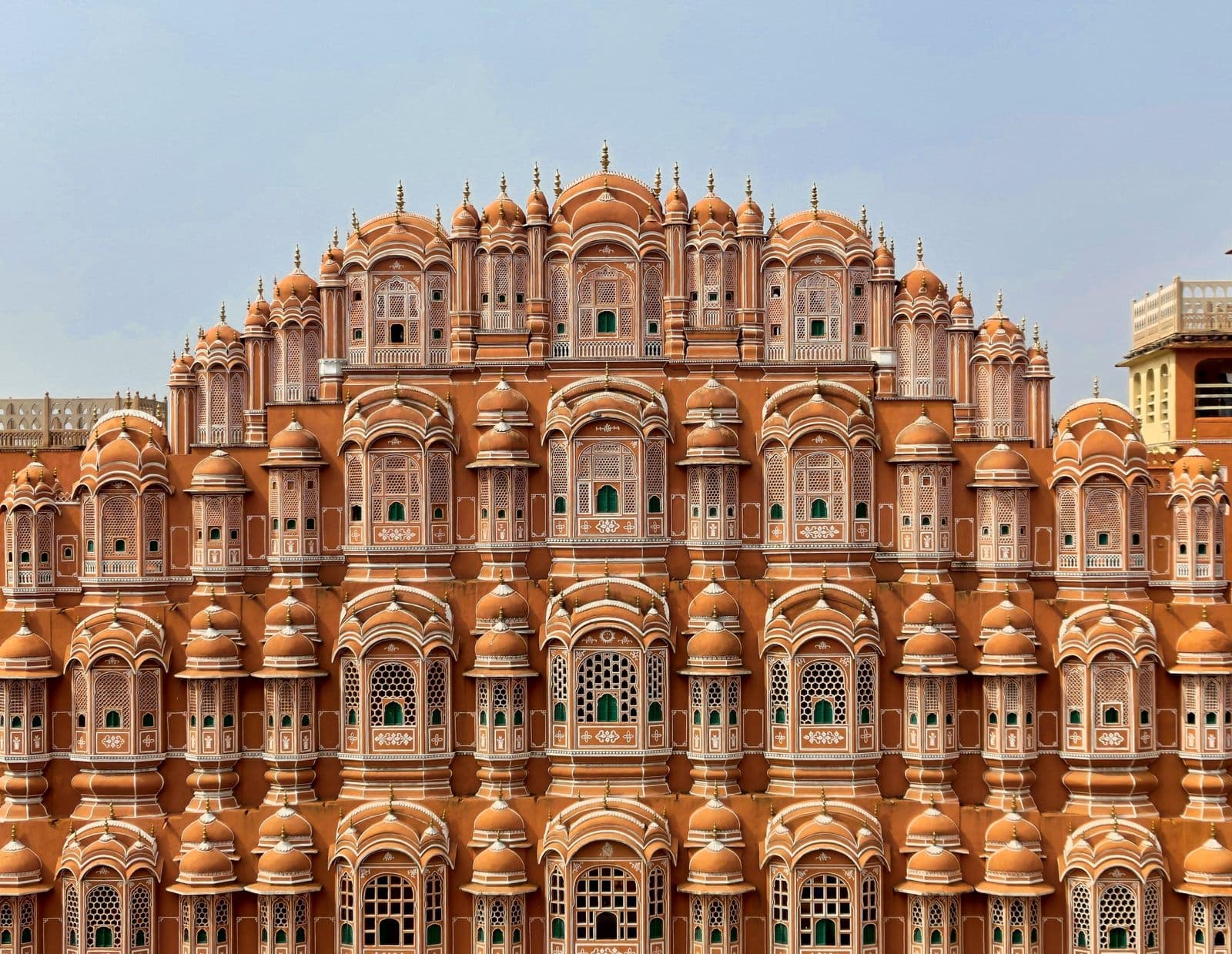 The pink sandstone face of Hawa Mahal in Jaipur