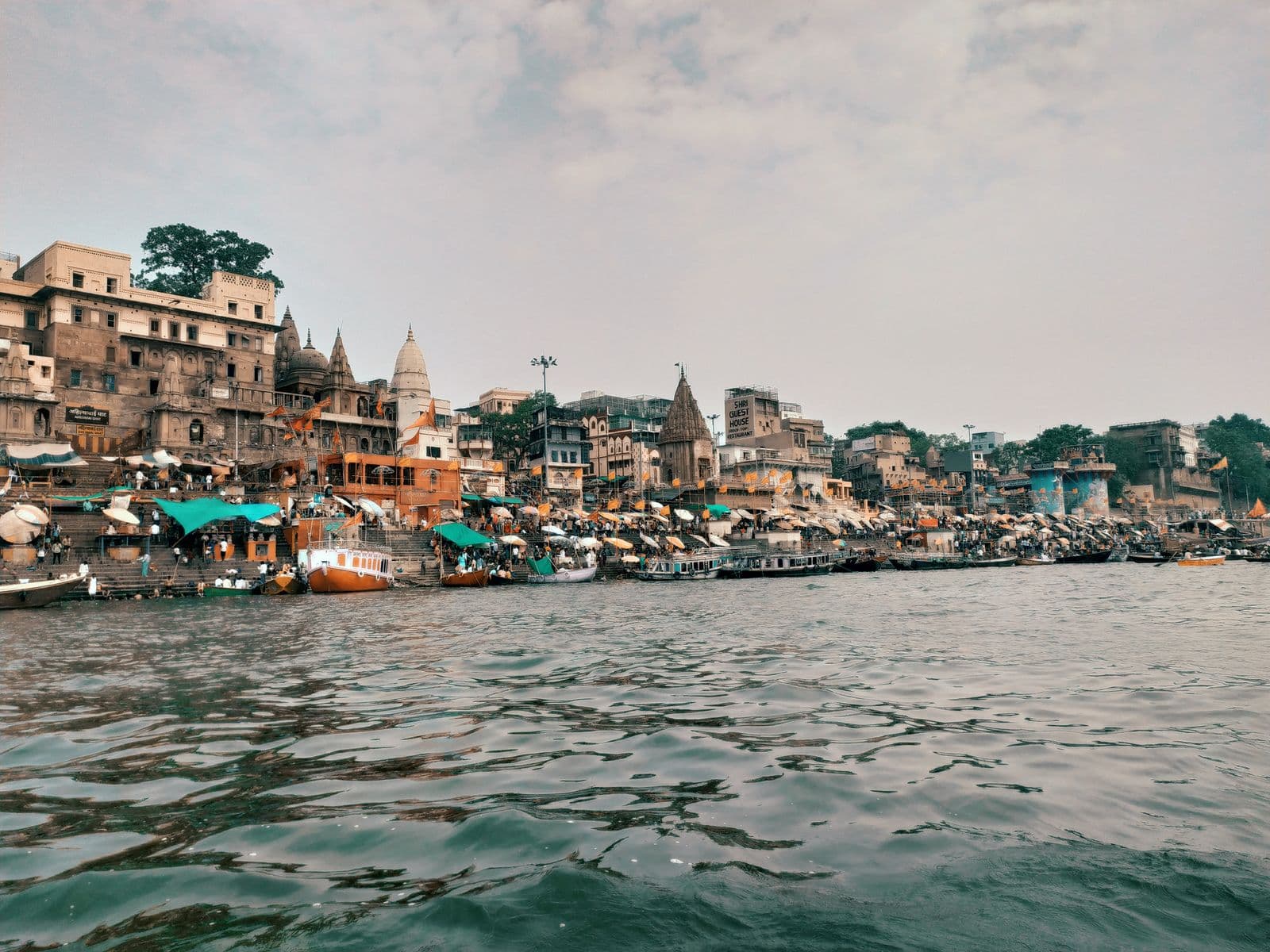 Boats and old buildings on the ghats of the Ganges in Varanasi